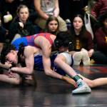 Thunder Mountain Middle School eighth grader Hanai Richey takes down Blatchley Huskies Reece Howard in their 123-pound championship during the Southeast Middle School Regional Wrestling Tournament on Saturday at TMMS. (Klas Stolpe / Juneau Empire)