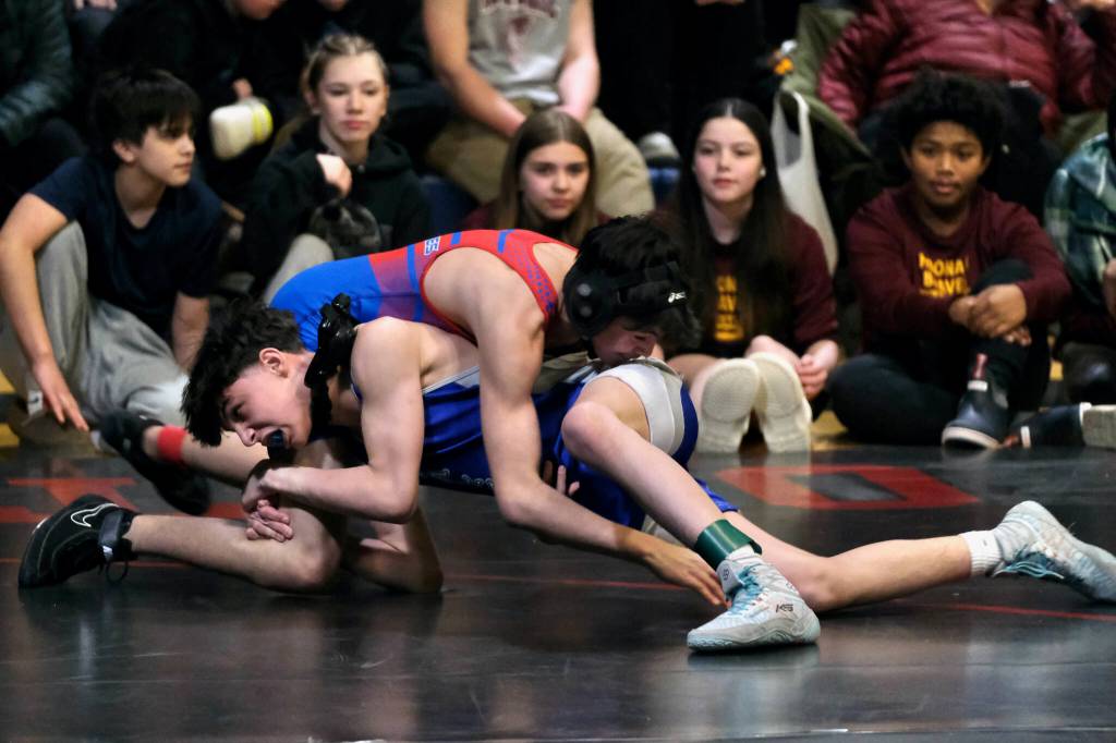 Thunder Mountain Middle School eighth grader Hanai Richey takes down Blatchley Huskies Reece Howard in their 123-pound championship during the Southeast Middle School Regional Wrestling Tournament on Saturday at TMMS. (Klas Stolpe / Juneau Empire)