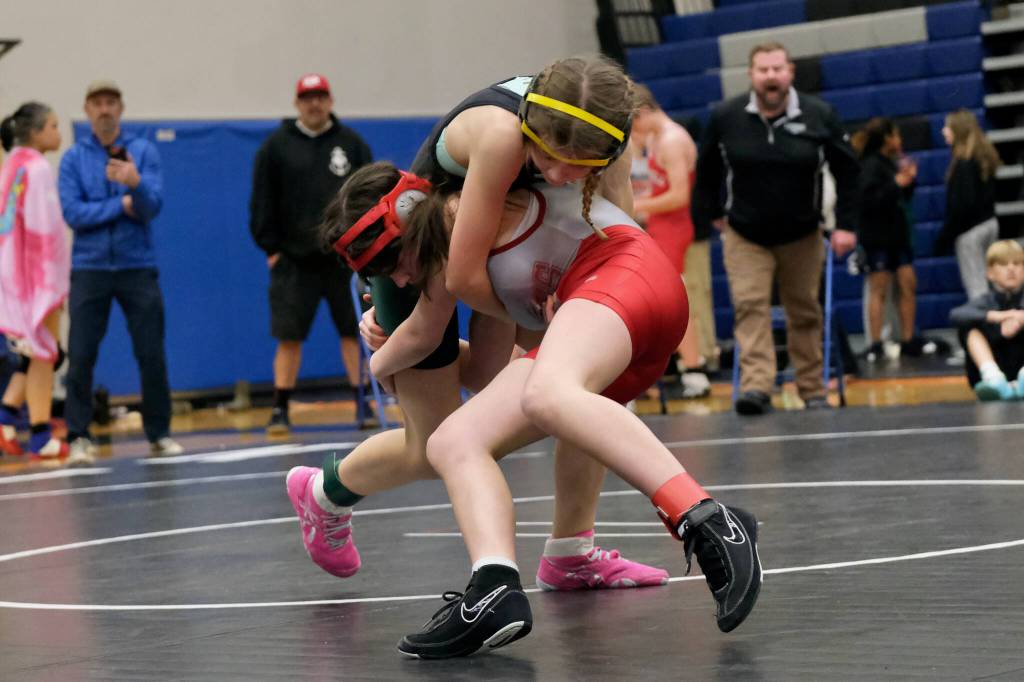 Thunder Mountain Middle School eighth grader Fiona McFarlin shoots against Craigs Adrianna Vickers during their girls 98-pound quarterfinal match in the Southeast Middle School Regional Wrestling Tournament on Saturday at TMMS. (Klas Stolpe / Juneau Empire)