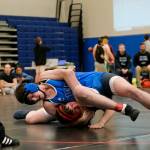 Schoenbars McKinley Nicholas attempts to pin Thunder Mountain Middle Schools Tayten Whitely in the 211-pound third place match during the Southeast Middle School Regional Wrestling Tournament on Saturday at TMMS. (Klas Stolpe / Juneau Empire)