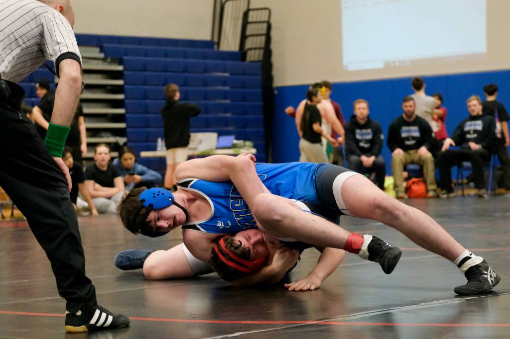 Schoenbars McKinley Nicholas attempts to pin Thunder Mountain Middle Schools Tayten Whitely in the 211-pound third place match during the Southeast Middle School Regional Wrestling Tournament on Saturday at TMMS. (Klas Stolpe / Juneau Empire)