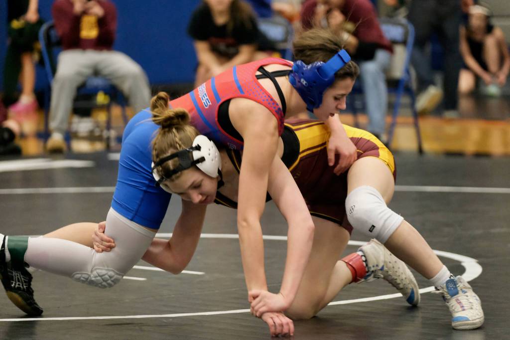 Blatchleys Payton Bergman and Hoonahs Payton Smith grapple in their 106-pound match during the Southeast Middle School Regional Wrestling Tournament on Saturday at Thunder Mountain Middle School. (Klas Stolpe / Juneau Empire)