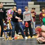 Wrangells Stikine Middle School coaches Della Churchill and Jack Carney instruct Wolves wrestler Clara Carney in a girls 129 pound match against Schoenbar Knights Kendall Hamilton during the Southeast Middle School Regional Wrestling Tournament on Saturday at Thunder Mountain Middle School. (Klas Stolpe / Juneau Empire)