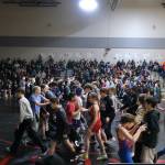 Middle school wrestlers in the championship finals participate in a mass greeting prior to the spotlight matches of the Southeast Middle School Regional Wrestling Tournament on Saturday at Thunder Mountain Middle School. (Klas Stolpe / Juneau Empire)