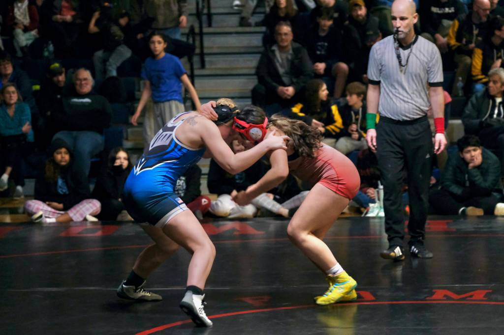 Schoenbar Knights Ella Kolean and Thunder Mountain Middle School seventh grader Haylee Ondreyka square off in the girls 146-pound championship during the Southeast Middle School Regional Wrestling Tournament on Saturday at TMMS. (Klas Stolpe / Juneau Empire)