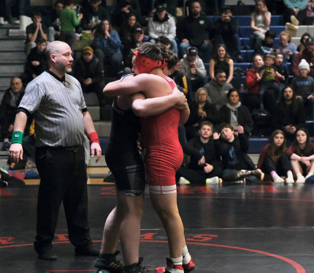 Thunder Mountain Middle School eighth grader Braeden Lee Antrim embraces Stikines Everett Edens after winning their 211-pound championship match during the Southeast Middle School Regional Wrestling Tournament on Saturday at TMMS. (Klas Stolpe / Juneau Empire)