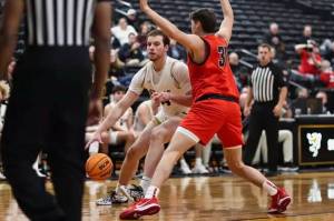 2024 Thunder Mountain High School graduate James Polasky (34) is shown in action for St. Olaf College against the University of Wisconsin-River Falls this past November in the Oles gym in Minnesota. (Photo courtesy St. Olaf College)