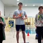 Glacier Swim Clubs Levi Phelps, center, was 1st place high point winner for 14 year old boys at the Alaska Age Group Champs in Fairbanks over the weekend. At left is third place Noah Unks of Chugiak Aquatics Club and at right is second place Haoran Zhang of Midnight Sun Swim Team. (Photo courtesy GSC)