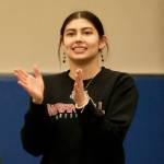 Wrangell senior Della Churchill applauds the effort of a Stikine Middle School wrestler during the Southeast Middle School Regional Wrestling Championships at Thunder Mountain Middle School last week. (Klas Stolpe / Juneau Empire)