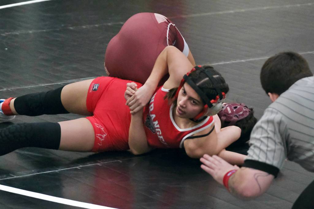 Wrangell senior Della Churchill pins Ketchikans Minh-thu Vo during their 126-pound match at the 2024 Southeast Showdown Wrestling Tournament in Juneaus George Houston Gymnasium. (Klas Stolpe / Juneau Empire)