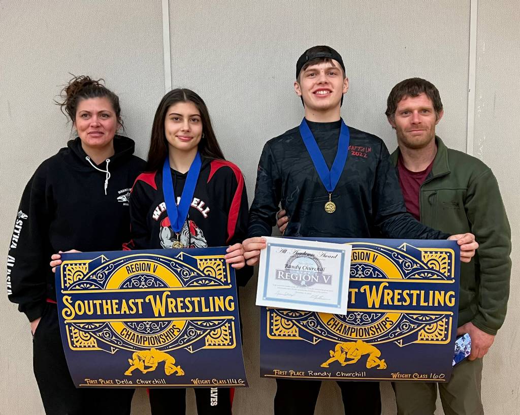 Mother Celsee Churchill, sophomore Della, senior Randy III and father Randy Churchill Jr. at the 2022 Region V Championships after Della and Randy III won their respective 114- and 160-pound weight division titles. (Photo courtesy Della Churchill)