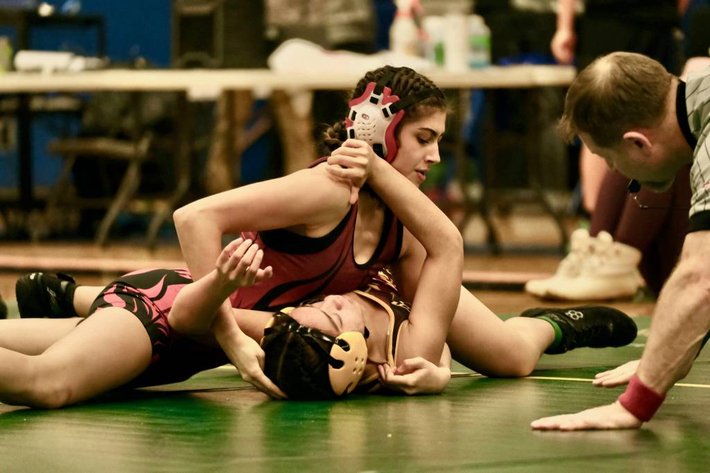 Wrangells Della Churchill, then a junior, pins Mt. Edgecumbe junior Nevaeh George in the girls 114-pound championship match of the 2023 ASAA Region V wrestling tournament at Thunder Mountain High School in Juneau. Churchill was selected the Outstanding Female Wrestler in the tournament. (Klas Stolpe)