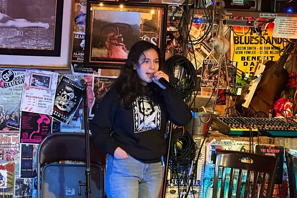 Maria Diaz talks about being an employee at the Mendenhall Glacier Visitor Center until she was fired last Friday, as part of a mass purge of federal workers nationwide, during a Fired Side Chats gathering Friday night at The Alaskan Hotel and Bar. (Mark Sabbatini / Juneau Empire)