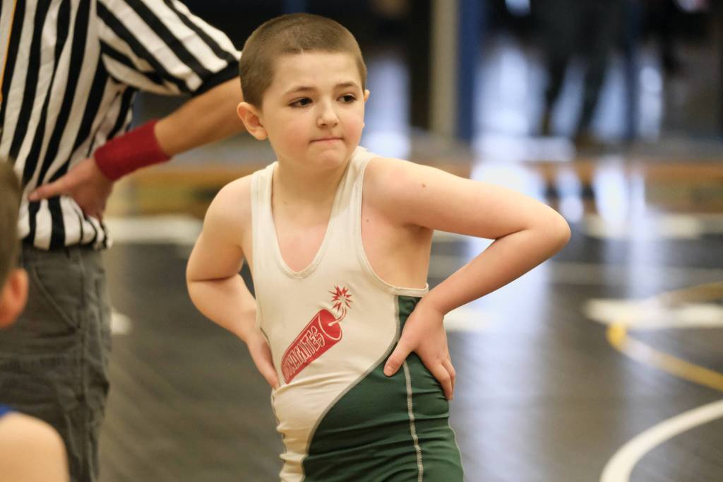 A youth wrestler waits for his match to start during Saturdays elementary school age wrestling tournament at Thunder Mountain Middle School. (Klas Stolpe / Juneau Empire)