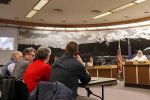 Huna Totem Corp. team members meet with the City and Borough of Juneau Assembly in a work session on the companys proposed Aakw Landing project on Feb. 24, 2025. (Jasz Garrett / Juneau Empire)