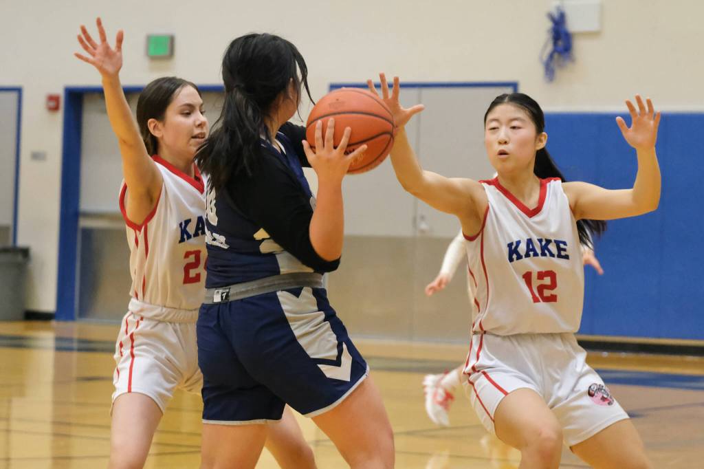 Kake sophomore Brookyn Hallingstad (24) and junior Lydia Chang (12) pressure Angoon junior Jessie Nelson (10) during the Lady Thunderbirds 54-12 win over the Eagles on Wednesday during the 2025 Alaska Airlines Region V 1A Girls Basketball Tournament at Thunder Mountain Middle School. (Klas Stolpe / Juneau Empire)