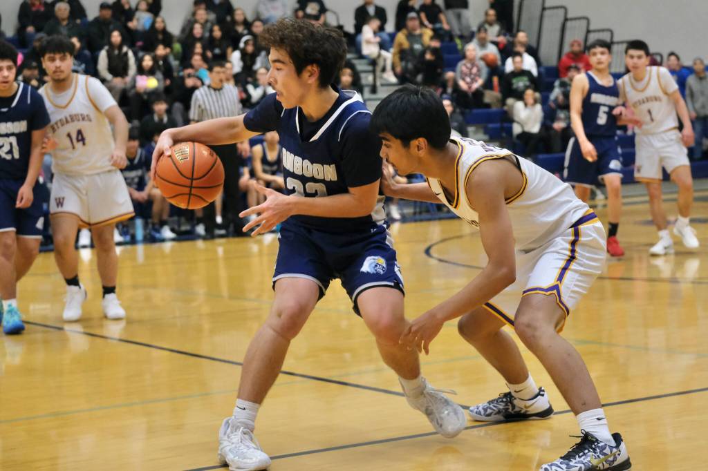 Angoons Beebuks Kookesh spins around Hydaburgs Alan Kaneki in the Eagles 48-45 loss to the Warriors during the 2025 Alaska Airlines Region V 1A Boys Basketball Tournament at Thunder Mountain Middle School. (Klas Stolpe / Juneau Empire)
