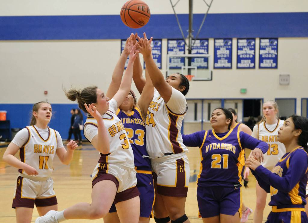 Hoonah and Hydaburg players battle for a rebound in the Lady Braves 46-16 win over the Lady Warriors Wednesday during the 2025 Alaska Airlines Region V 1A Girls Basketball Tournament at Thunder Mountain Middle School. (Klas Stolpe / Juneau Empire)