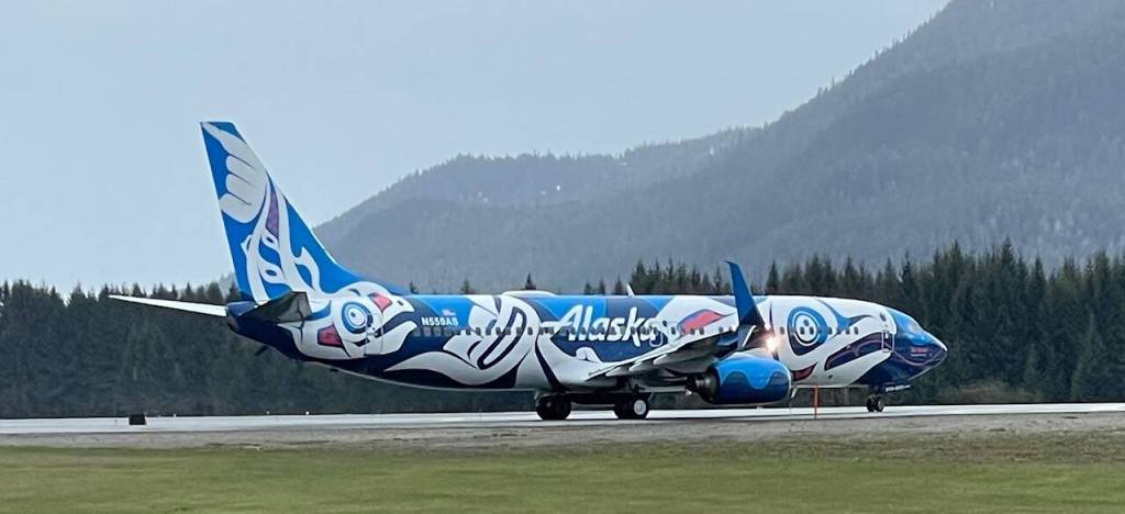 Plane spotting is a favorite pastime for Airport Dike Trail users, especially when Alaska Airlines debuted local Tlingit artist Crystal Worls livery on a Boeing 737 in Juneau in May of 2023. (Photo by Laurie Craig)