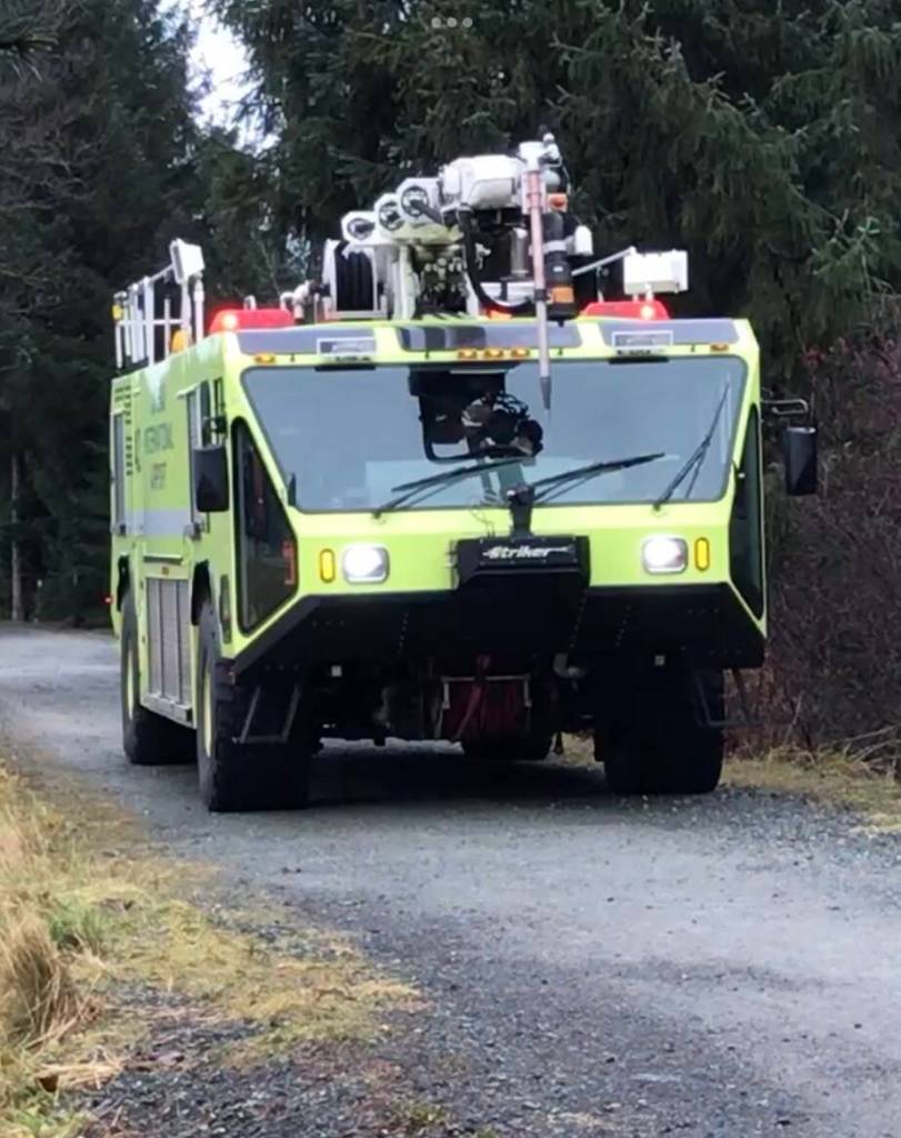 A Capital City Fire/Rescue team on Dec. 3, 2020, trains for emergency rescues driving the bright green Airport Rescue and Firefighting (ARFF) vehicle on the Airport Dike Trail which is officially the Emergency Vehicle Access Road. (Photo by Laurie Craig)