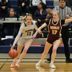 Skagways Kaitlyn Tronrud (13) dribbles under pressure from Hoonahs Paige Woitte (13) Thursday during the 2025 Alaska Airlines Region V 1A Girls Basketball Tournament at Thunder Mountain Middle School. (Klas Stolpe / Juneau Empire)