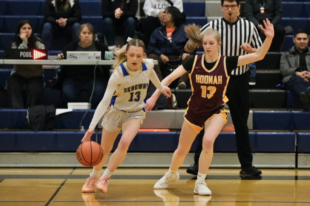 Skagways Kaitlyn Tronrud (13) dribbles under pressure from Hoonahs Paige Woitte (13) Thursday during the 2025 Alaska Airlines Region V 1A Girls Basketball Tournament at Thunder Mountain Middle School. (Klas Stolpe / Juneau Empire)