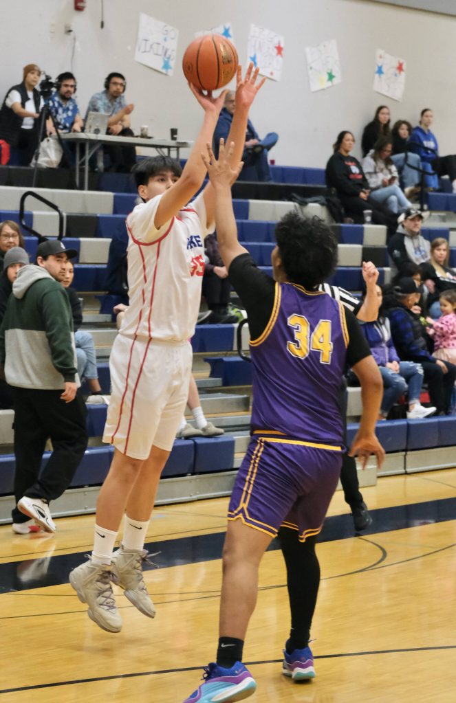 Kakes Devin Aceveda (35) shoots over Hydaburgs Maika Olap (34) in the Thunderbirds win over the Warriors on Thursday during the 2025 Alaska Airlines Region V 1A Boys Basketball Tournament at Thunder Mountain Middle School. (Klas Stolpe / Juneau Empire)