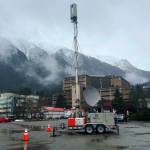 A portable FirstNet cell tower to provide ATT service is set up in the parking lot of the Juneau Arts and Culture Center on Friday afternoon following a widespread phone and internet outage that began Thursday night. (Mark Sabbatini / Juneau Empire)