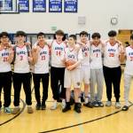 The Kake Thunderbirds pose after their 56-40 win over the Klawock Chieftains on Friday during the Region V 1A Boys Basketball Tournament Championship game at Thunder Mountain Middle School. (Klas Stolpe / Juneau Empire)
