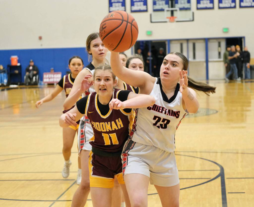 Hoonahs Easton Ross (11) and Klawocks Lea Armour (23) go for a rebound during the Braves 56-40 loss to the Chieftains on Friday during the 2025 Region V 1A Girls Basketball Tournament Championship game at Thunder Mountain Middle School. (Klas Stolpe / Juneau Empire)