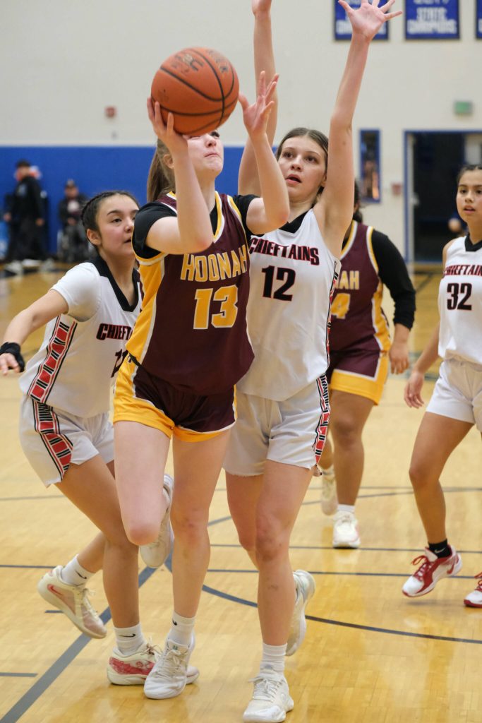 Hoonahs Paige Woitte (13) shoots under pressure from Klawocks Jayla Edenshaw (11) and Kaiya Martin (12) during the Braves 34-33 loss to the Chieftains on Friday during the 2025 Region V 1A Girls Basketball Tournament Championship game at Thunder Mountain Middle School. (Klas Stolpe / Juneau Empire)
