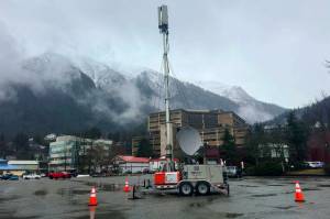 A portable FirstNet cell tower to provide ATT service is set up in the parking lot of the Juneau Arts and Culture Center on Friday afternoon following a widespread phone and internet outage that began Thursday night. (Mark Sabbatini / Juneau Empire)