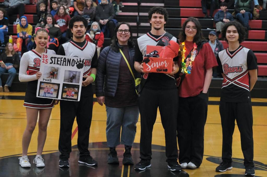 Friends and family of Juneau-Douglas High School: Yadaa.at Kalé Crimson Bears senior Stefano Rivera during Senior Night honors Saturday at the George Houston Gymnasium. (Klas Stolpe / Juneau Empire)