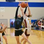 Skagway senior Kaitlyn Tronrud (13) and Hoonah junior Easton Ross (11) rebound during Saturdays Region V 1A Girls Runner-Up game at Thunder Mountain Middle School. Hoonah won 31-19 for the second berth to state in Anchorage. Klawock won the championship berth Friday. (Klas Stolpe / Juneau Empire)