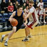 Skagway junior Camden Lawson (15) dribbles past Klawock sophomore Tristin Ryno (1) in the Panthers 53-49 win over the Chieftains on Saturday in the Region V 1A tournament runner-up game at Thunder Mountain Middle School. The game determined the second berth to the state tournament in Anchorage. Kake won the championship berth to state Friday. (Klas Stolpe / Juneau Empire)