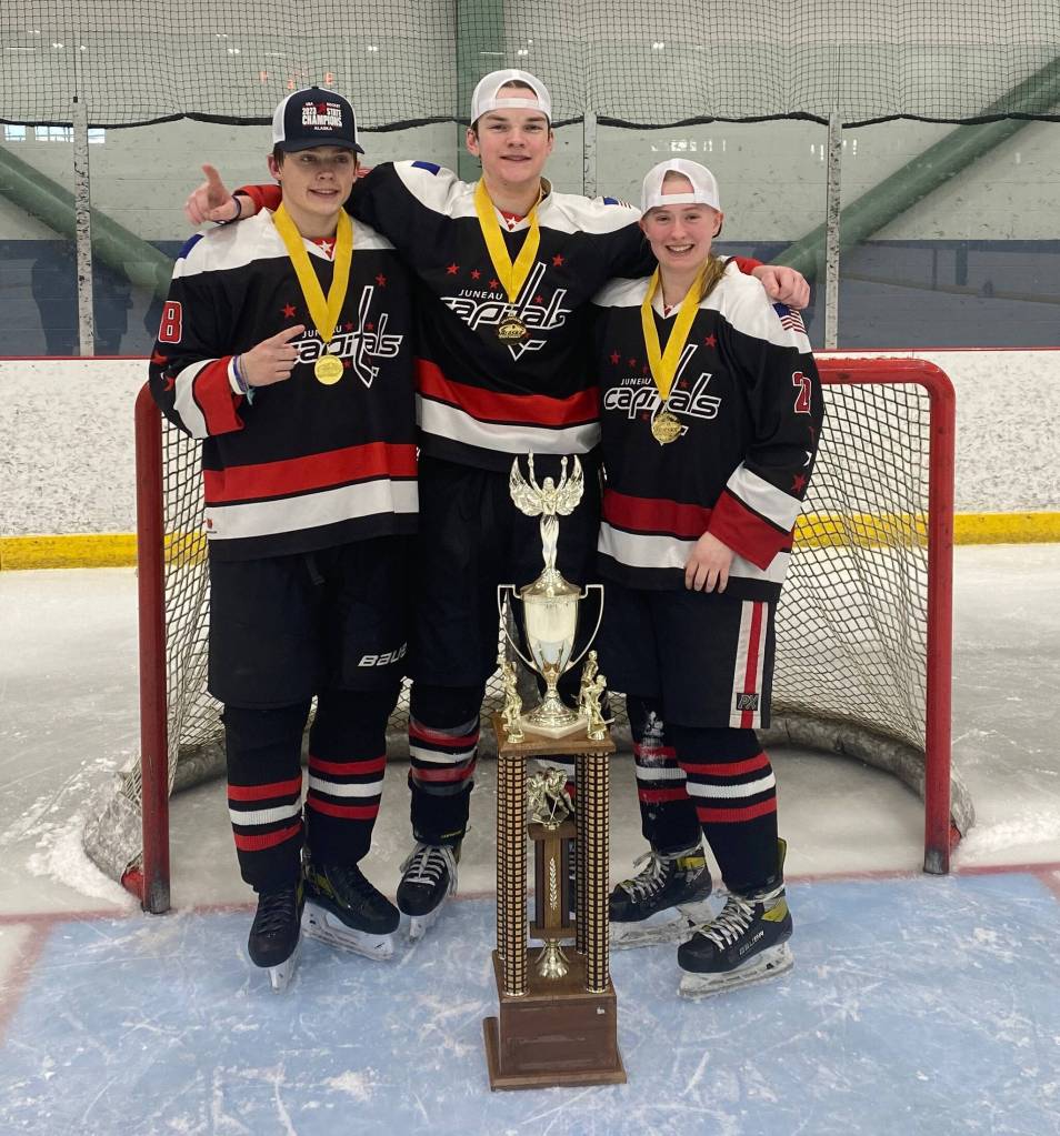 JDIA Juneau Capitals players Karter Kohlhase, Brandon Campbell and Anna Dale after winning the U18 state championship. (Photo courtesy Anna Dale)
