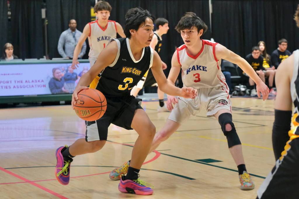 Kakes Talen Davis (3) defends King Coves Riley Wilson (3) during the Thunderbirds 61-41 win over the T-Jacks in the 2025 ASAA March Madness Alaska 1A/2A State Basketball Championships on Wednesday at Anchorages Alaska Airlines Center (Klas Stolpe / Juneau Empire)