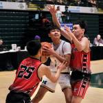 Metlakatlas Gianni Scudero-Hayward (1) powers through Chevaks Liam Pingayak Green (25) and Anthony Martins (21) in the Chiefs 66-33 win over the Comets in the 2025 ASAA March Madness Alaska 1A/2A State Basketball Championships on Thursday at Anchorages Alaska Airlines Center (Klas Stolpe / Juneau Empire)