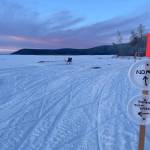 Signs in front of Tolovana Roadhouse instruct Iditarod mushers which way to go during the 2025 Iditarod sled dog race in early March 2025. (Photo by Ned Rozell)