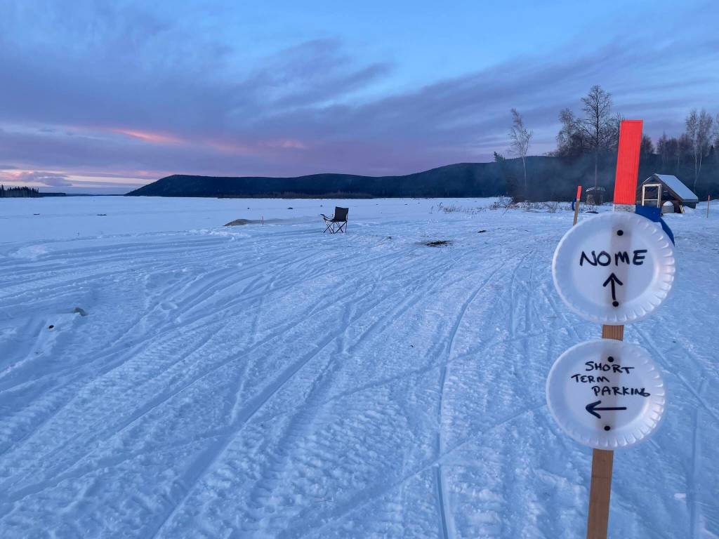 Signs in front of Tolovana Roadhouse instruct Iditarod mushers which way to go during the 2025 Iditarod sled dog race in early March 2025. (Photo by Ned Rozell)