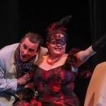 Rosalinda (Sara Radke Brown) steals her husbands watch that he claims bewitches women during a rehearsal of Die Fledermaus on Wednesday, March 12, 2025. (Jasz Garrett / Juneau Empire)