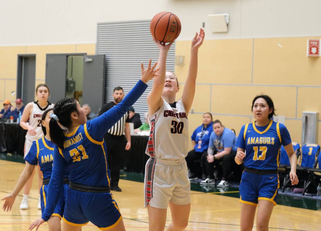 Klawocks Alli Demmert (30) scores over Nunamiuts Eileen Panigeo (21) during the Chieftains 53-25 win over the Amaguqs in the 2025 ASAA March Madness Alaska 1A State Basketball Championships Thursday at Anchorages Alaska Airlines Center. (Klas Stolpe / Juneau Empire)