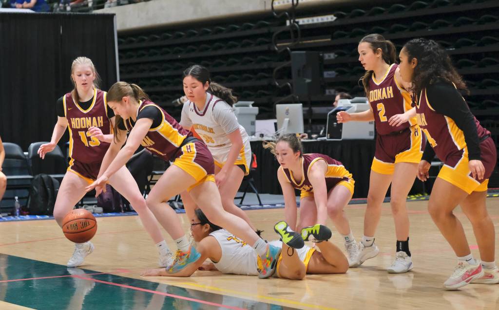 Hoonahs Easton Ross starts a fast break against Shaktoolik as teammates Paige Woitte (13), Jora Savland, Jenna Jack (2) and Nevaeh Campbell get set during the Braves 55-37 loss to the Huskies Thursday in the 2025 ASAA March Madness Alaska 1A State Basketball Championships at Anchorages Alaska Airlines Center. (Klas Stolpe / Juneau Empire)