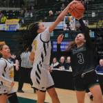 Skagways Logan Rupprecht (23) challenges Scammon Bays Mica Uttereyuk (42) during the Panthers 71-48 win over the Eagles on Thursday in the 2025 ASAA March Madness Alaska 1A State Basketball Championships at Anchorages Alaska Airlines Center (Klas Stolpe / Juneau Empire)