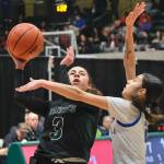 Haines Ariel Godinez-Long (3) scores over Metlakatlas Saahdia Buffalo during the Glacier Bears 58-34 loss to the MisChiefs on Friday in the 2025 ASAA March Madness Alaska 2A State Basketball Championships at Anchorages Alaska Airlines Center (Klas Stolpe / Juneau Empire)