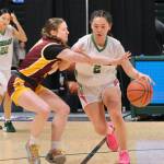 Hoonahs Easton Ross defends Shishmarefs Makayla Nayokpuk (2) during the Braves 43-40 loss to the Northern Lights on Friday in the 2025 ASAA March Madness Alaska 1A State Basketball Championships at Anchorages Alaska Airlines Center (Klas Stolpe / Juneau Empire)