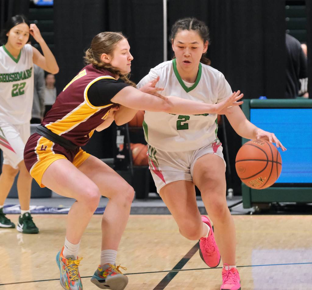 Hoonahs Easton Ross defends Shishmarefs Makayla Nayokpuk (2) during the Braves 43-40 loss to the Northern Lights on Friday in the 2025 ASAA March Madness Alaska 1A State Basketball Championships at Anchorages Alaska Airlines Center (Klas Stolpe / Juneau Empire)