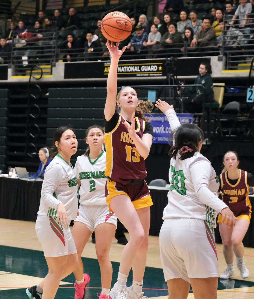 Hoonahs Paige Woitte scores over Shishmarefs Renee Kiyutelluk (30) during the Braves 43-40 loss to the Northern Lights on Friday in the 2025 ASAA March Madness Alaska 1A State Basketball Championships at Anchorages Alaska Airlines Center (Klas Stolpe / Juneau Empire)