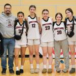 The Klawock Chieftains pose after their final game Friday in the 2025 ASAA March Madness Alaska 1A State Basketball Championships at Anchorages Alaska Airlines Center (Klas Stolpe / Juneau Empire)