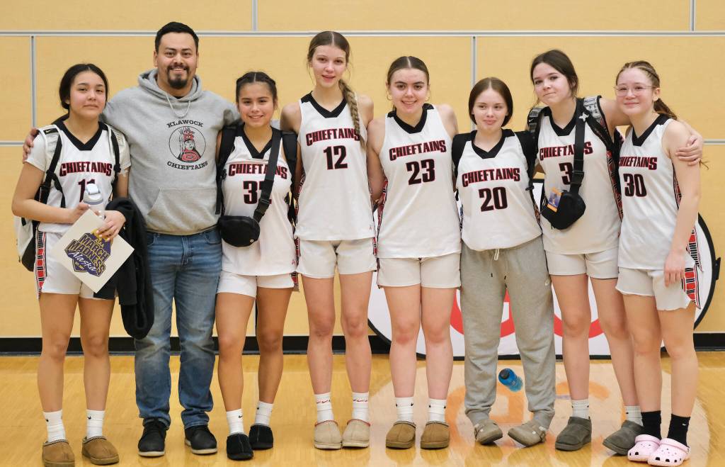 The Klawock Chieftains pose after their final game Friday in the 2025 ASAA March Madness Alaska 1A State Basketball Championships at Anchorages Alaska Airlines Center (Klas Stolpe / Juneau Empire)
